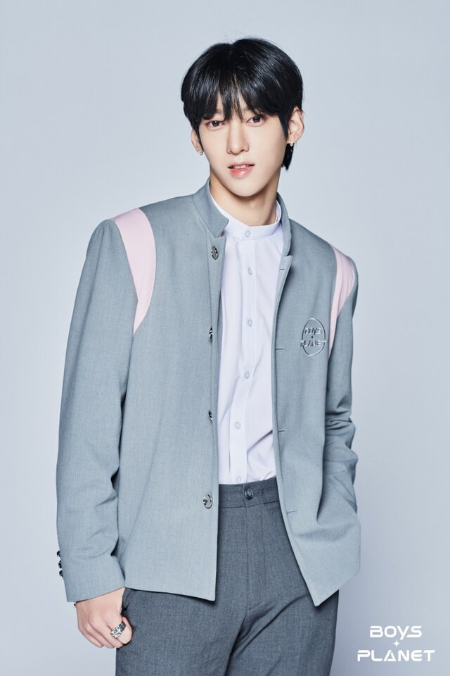 FNC Warns of Firm Action Amidst 'Boys Planet' Na Kamden's Father's Inappropriate SNS Conduct Causing Severe Distress